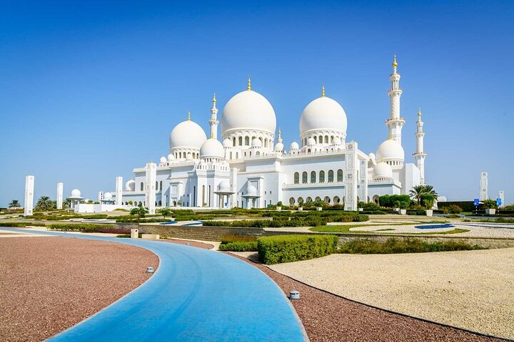 Explore the stunning architectural beauty of Sheikh Zayed Grand Mosque where each detail reflects heritage and artistry perfectly paired with the excitement of Ferrari World for an unforgettable experience.